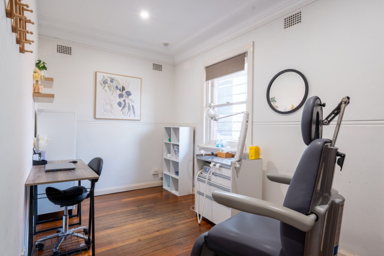 Modern medical treatment room with examination chair